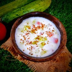 A picture of Cucumber tomato raita.