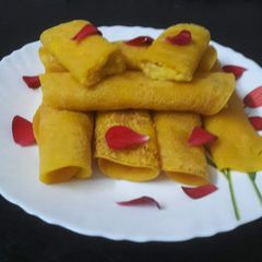 A picture of Mango pancakes stuffed with mango Rava/ Mango Patisapta(Bengali name).
