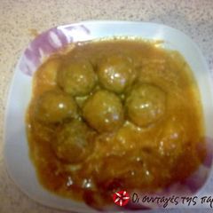 A picture of Giouvarlakia in tomato sauce with avgolemono.