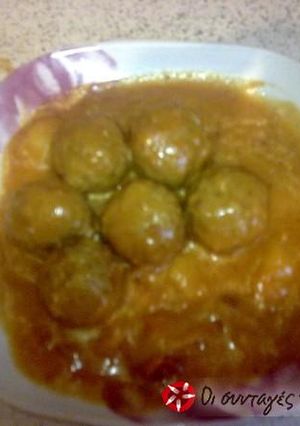A picture of Giouvarlakia in tomato sauce with avgolemono.
