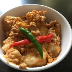 A picture of Steamed paneer in tomato and cashew paste (100% oil free).