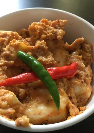 A picture of Steamed paneer in tomato and cashew paste (100% oil free).