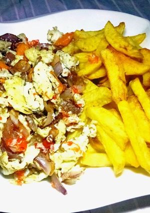 A picture of French Fries and Onions scrambled eggs.