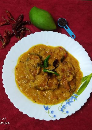 A picture of Rohu fish with raw mango.