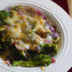 A picture of Butter Garlic Broccoli topped with cheese.