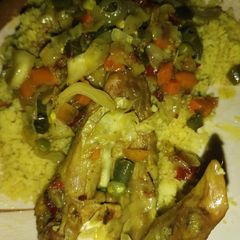 A picture of Couscous and veggies soup.
