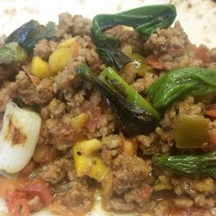 A picture of Mango-Bell Pepper Beef Tacos w/ Grilled Scallions.