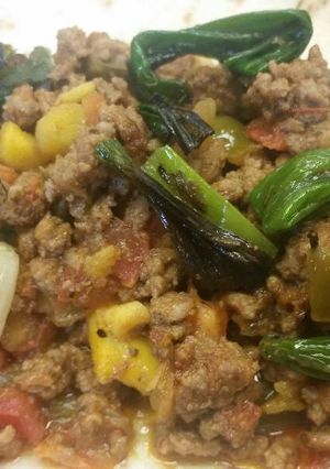 A picture of Mango-Bell Pepper Beef Tacos w/ Grilled Scallions.