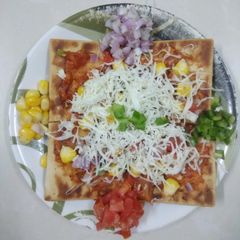 A picture of Corn Capsicum Pizza.