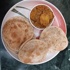 A picture of Bengali Style Fish Stuffed Kochuri.