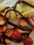 Strawberries & Bananas topped with chocolate syrup