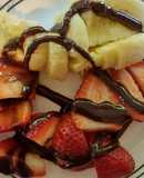 Strawberries & Bananas topped with chocolate syrup