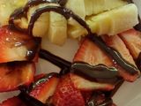Strawberries & Bananas topped with chocolate syrup
