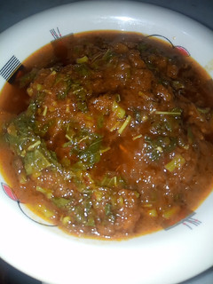 A picture of Pumpkin soup with spinach.
