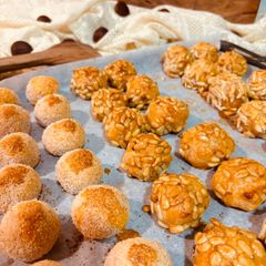 A picture of “PANELLETS” (sweet potato balls made with coconut, pine nuts, or almonds).