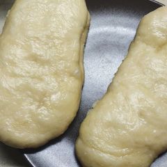 A picture of 馒头 STEAMED MILK BUNS. (I Made loaves).