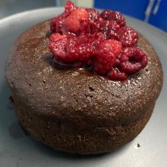 A picture of Flourless Chocolate Cake with Macerated Raspberry.