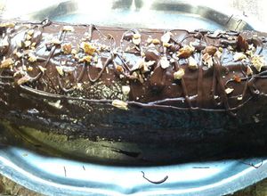 Una foto de Brazo de gitano (Pionono con cobertura de chocolate y almendras)