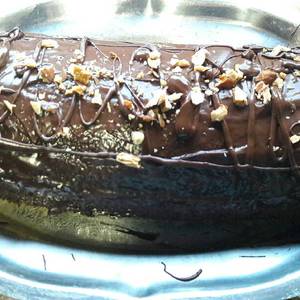 Brazo de gitano (Pionono con cobertura de chocolate y almendras)