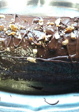 Una foto de Brazo de gitano (Pionono con cobertura de chocolate y almendras)