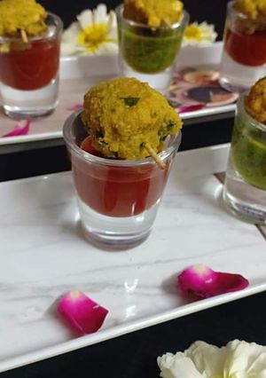 A picture of Methi chana daal pakodas shots.