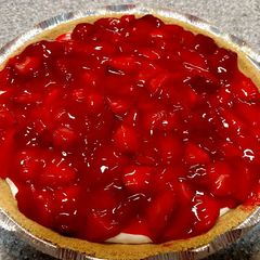 A picture of Cream cheese pie with strawberry topping.