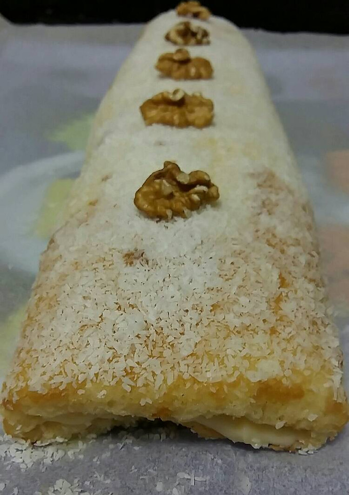 Una foto de Brazo gitano de crema y coco