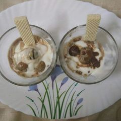 A picture of Pheda fudge with chocolate sauce.