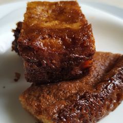 A picture of Chhena Poda with Jaggery.