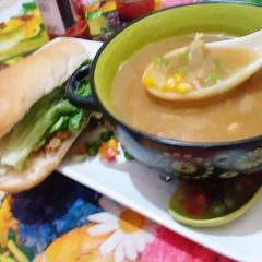 A picture of Vagitable sweet corn soup & chicken burger.