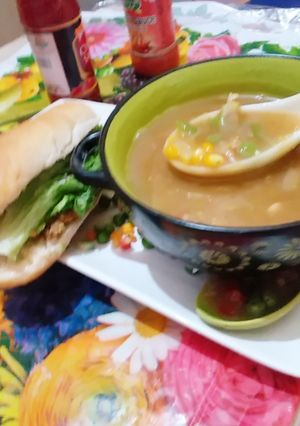 A picture of Vagitable sweet corn soup & chicken burger.