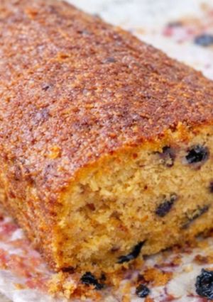 A picture of Orange Cake with Panela and Blueberries 🍊🫐.