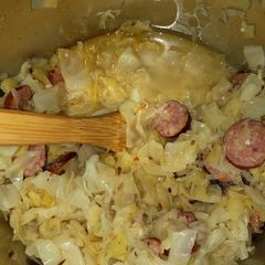 A picture of Cabbage and sausage with sauerkraut.