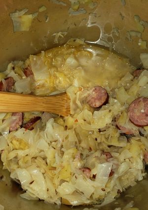 A picture of Cabbage and sausage with sauerkraut.