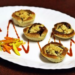 A picture of Bbq Paneer in toasted cups.