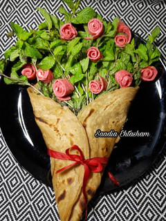 A picture of Achari omelet flowers and paratha bouquet.