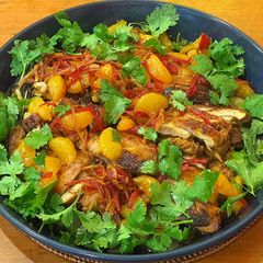 A picture of Blackened chicken with caramel and clementine dressing.