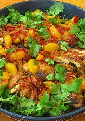 A picture of Blackened chicken with caramel and clementine dressing.