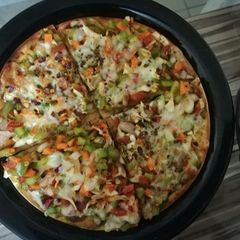 A picture of Homemade veg cheese pizza.