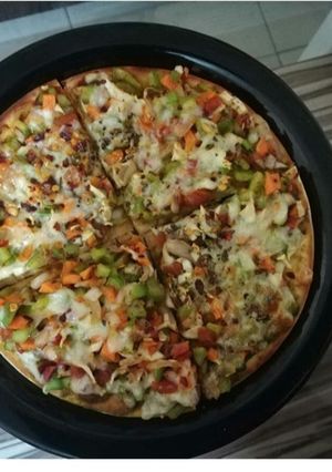 A picture of Homemade veg cheese pizza.