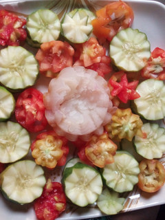 A picture of Cocumber, onions and tomatoes salad.