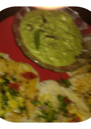A picture of Coconut green chutney with uttapam (mix veg).