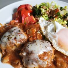 A picture of Meatball with tomato sauce.
