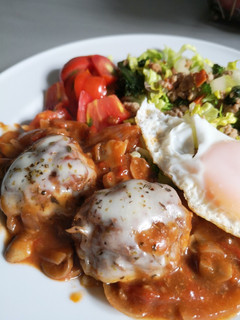 A picture of Meatball with tomato sauce.