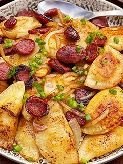 A picture of Brown Butter Pierogi with Wagyu Beef Kielbasa.