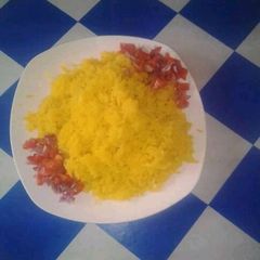 A picture of Tumeric Rice with kachumbari Salt.