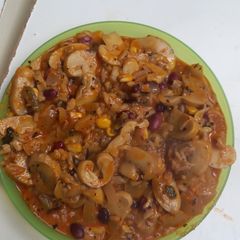 A picture of Hungarian Mushroom Paprikash with rice, wild rice, corn and red beans.