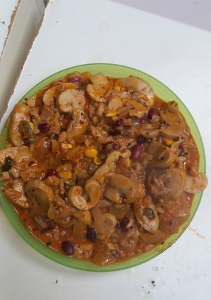 A picture of Hungarian Mushroom Paprikash with rice, wild rice, corn and red beans.