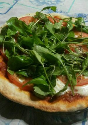 Una foto de Pizza de Rúcula