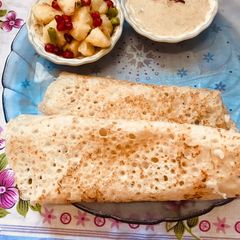 A picture of Bhagar Dosa with potato and green chatani.